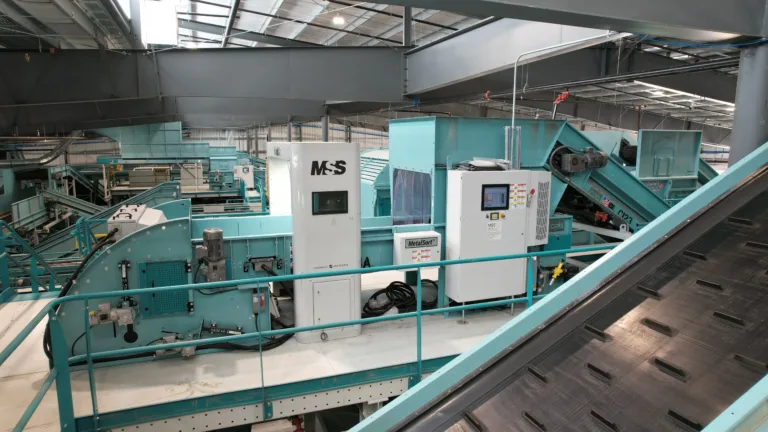 A teal Vivid Air recycling machine in an MRF.