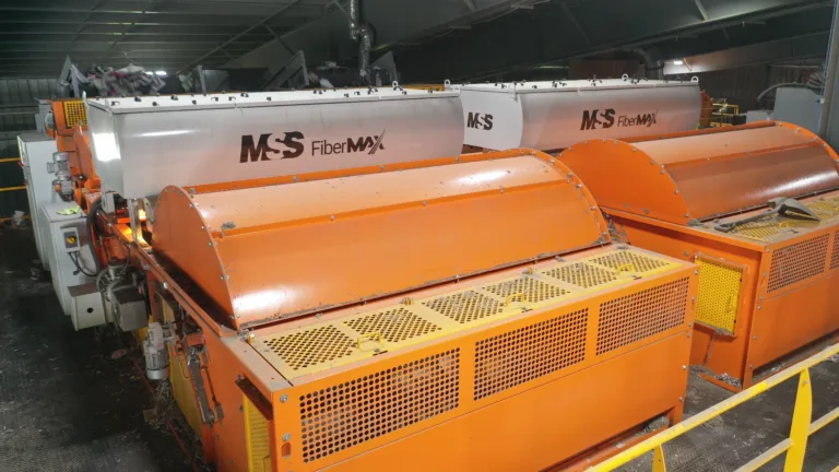 Two orange FiberMax recycling units next to each other in a MRF.