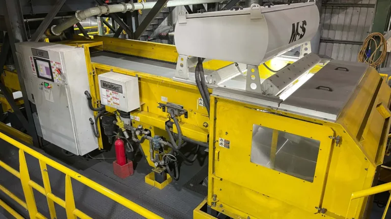 Image of a yellow LVIS recycling machine in a MRF.