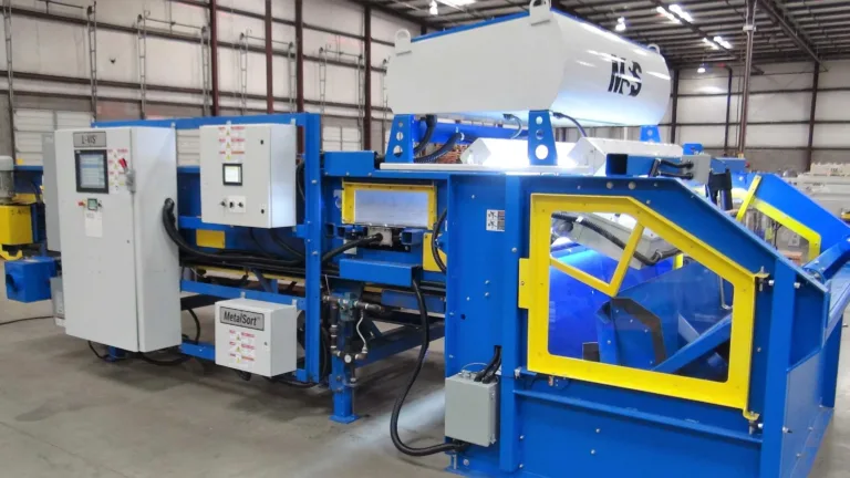 Image of a blue LVIS recycling machine in a warehouse.