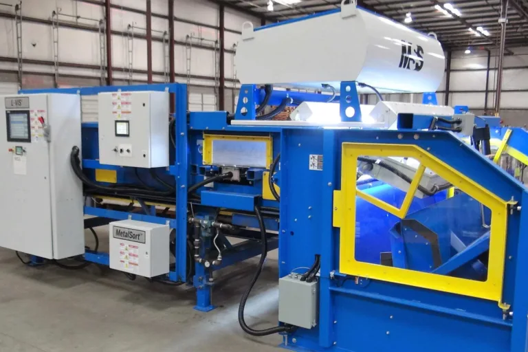 Image of a blue LVIS recycling machine in a warehouse.