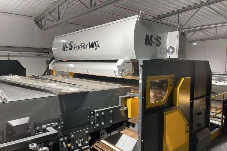 An image of a grey PureFilmMax optical sorting unit in a factory.